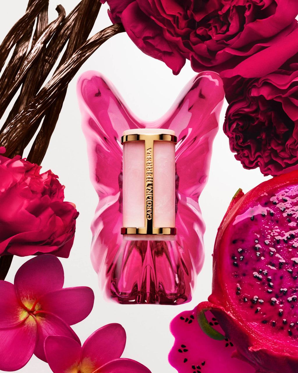 La Bomba EDP Carolina Herrera con frasco mariposa, flores rosa, vainilla y pitahaya
