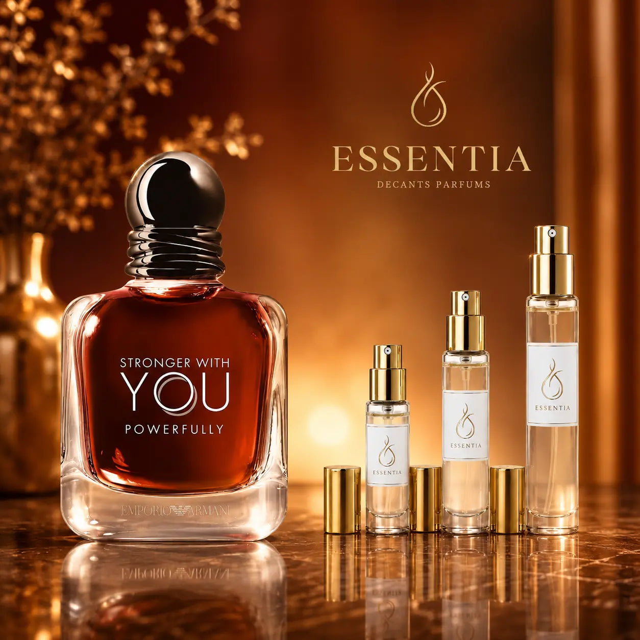 Imagen premium de Emporio Armani Stronger With You Powerfully Giorgio Armani junto a decants ESSENTIA de 3 ml, 5 ml y 10 ml sobre fondo ámbar y dorado elegante.